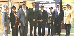 Elected officials and other library supporters proudly wear their 'no cap' baseball caps.